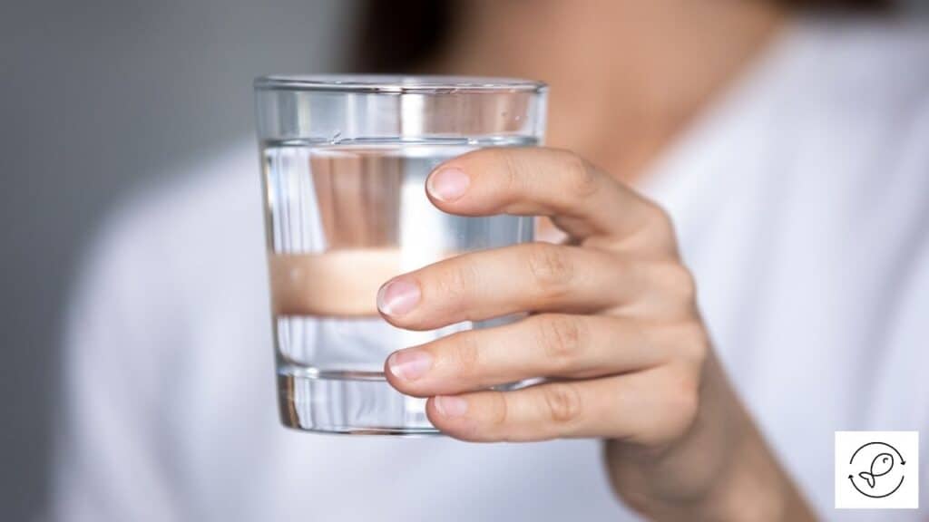 Image of a woman holding distilled water